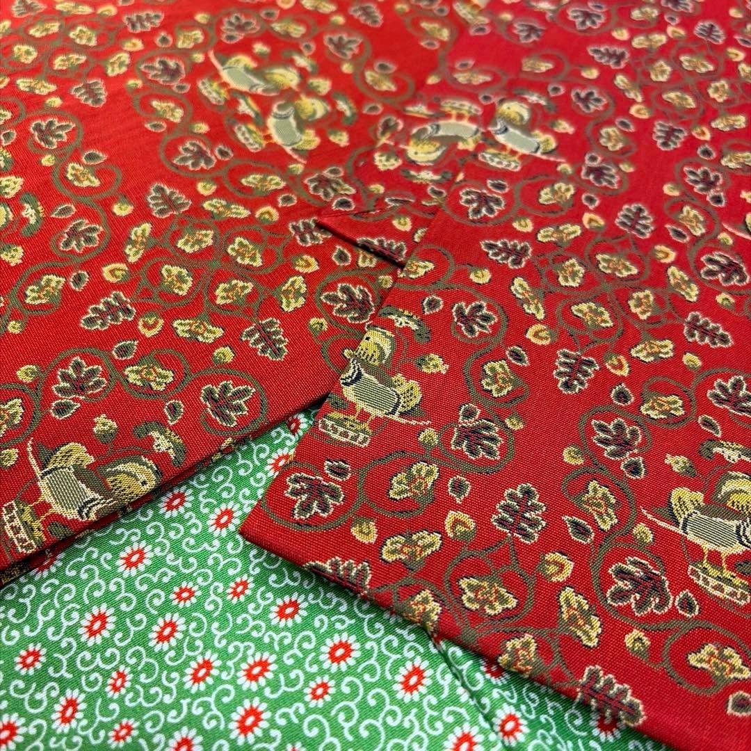 龍村美術織物-名古屋帯-赤￼地鴛鴦唐草柄￼