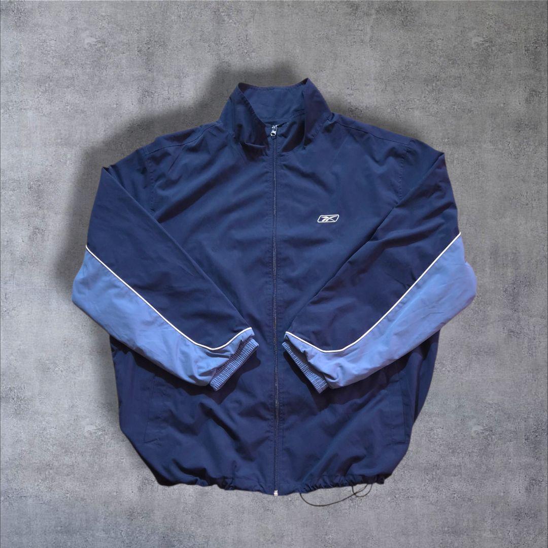 90s Reebokリーボックナイロンジャケット 刺繍ロゴ万国旗タグビッグサイズ