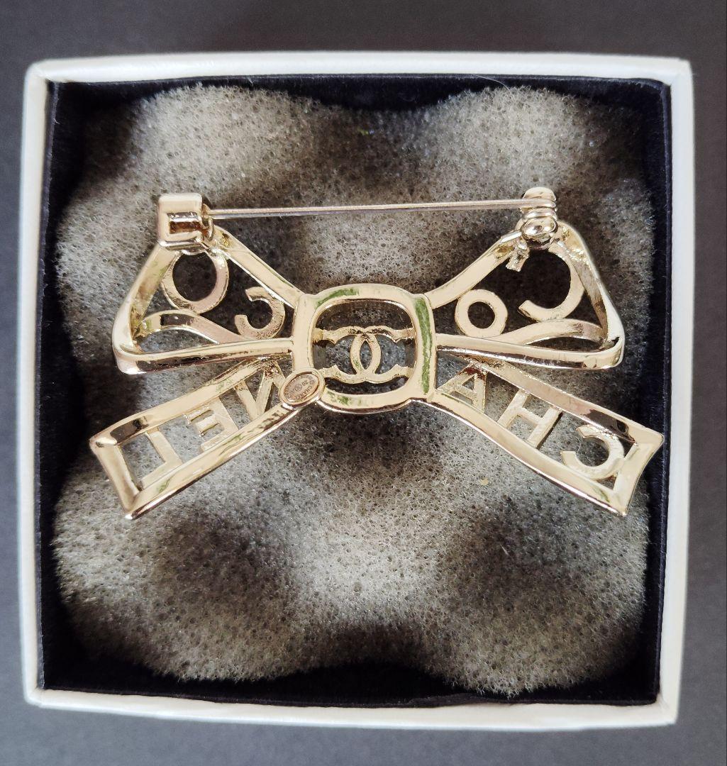 くるみぱん様検討中　CHANEL リボン型ブローチ シルバー