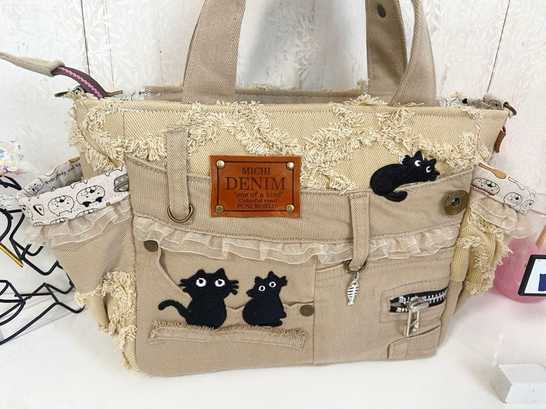デニムリメイクバックS 茶フリンジ猫