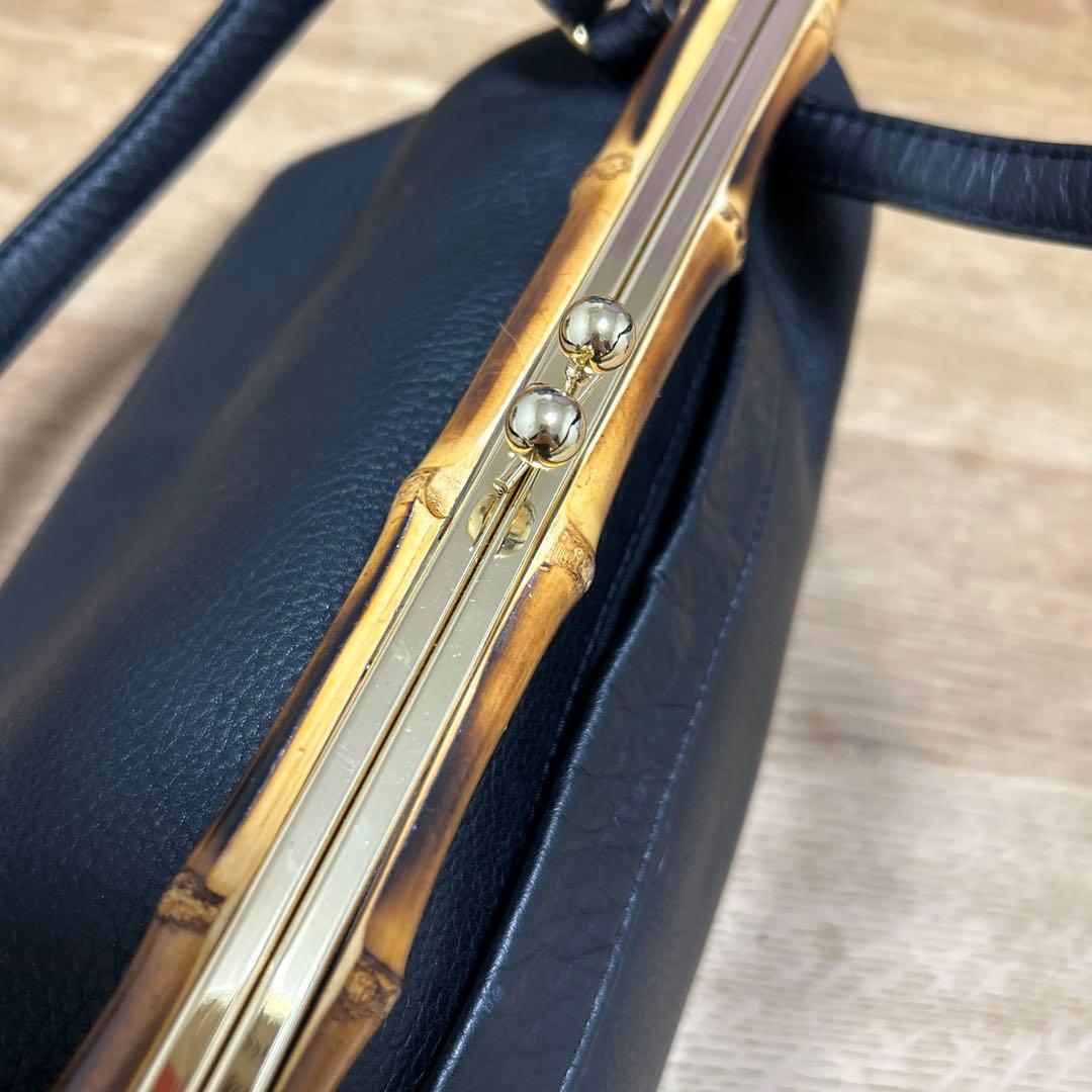 シ*ュ様 新品未使用　POMTATA 牛革　ハンドバッグがま口スコットクラブ系