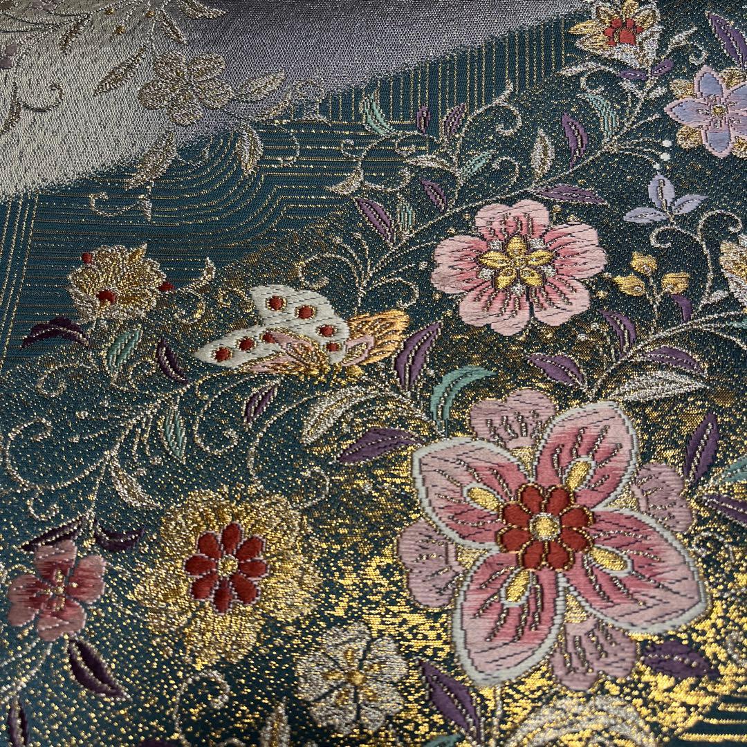 振袖用袋帯 青緑地に上品に煌めくピンクの美しい花々と白い蝶々（428㎝）